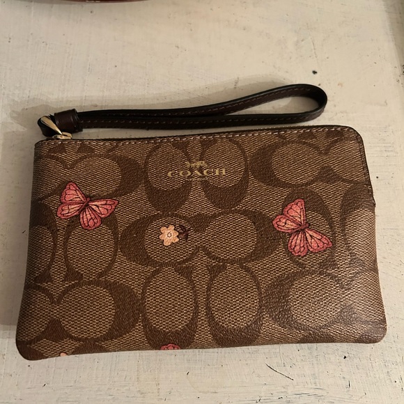Coach Handbags - Coach Brown Wristlet with Pink Butterfly Accents